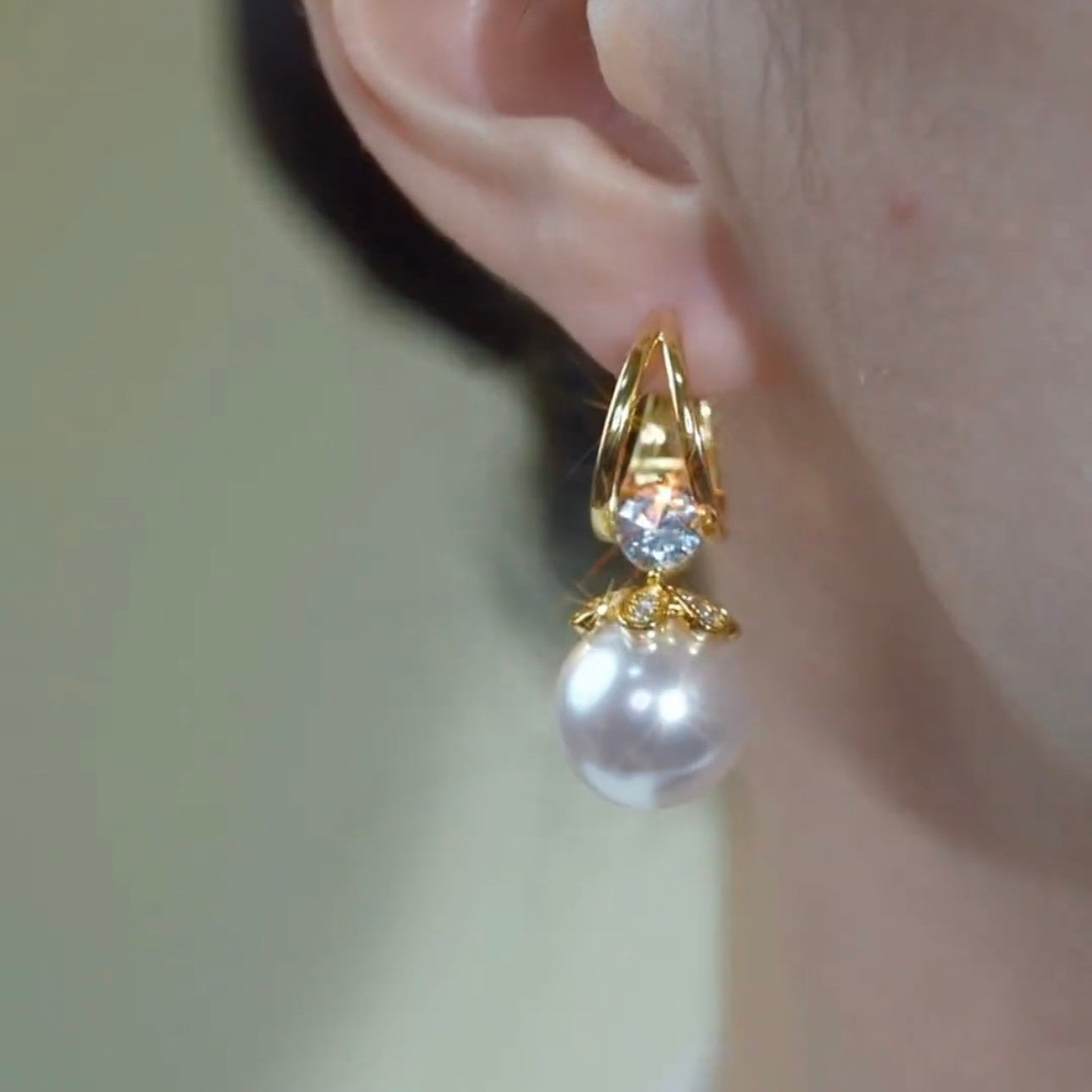Boucles d'oreilles dorée en perle argenté